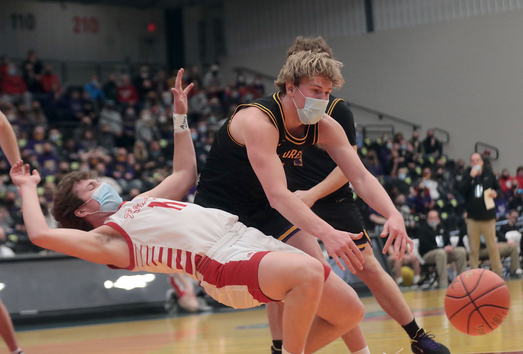 WIAA state boys basketball photo: DeForest's Nolan Hawk commits a charging foul